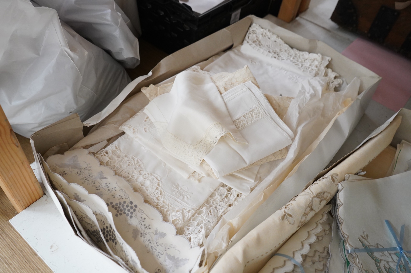 A collection of mixed damask embroidered and cutworked table cloths, napkin sets, hand towels and mats (in 3 boxes)